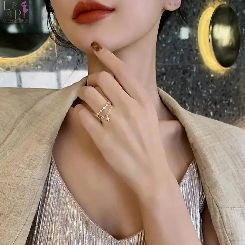 Open star-shaped jewelry ring for women featuring a pendant design, crafted with a sleek and elegant style.