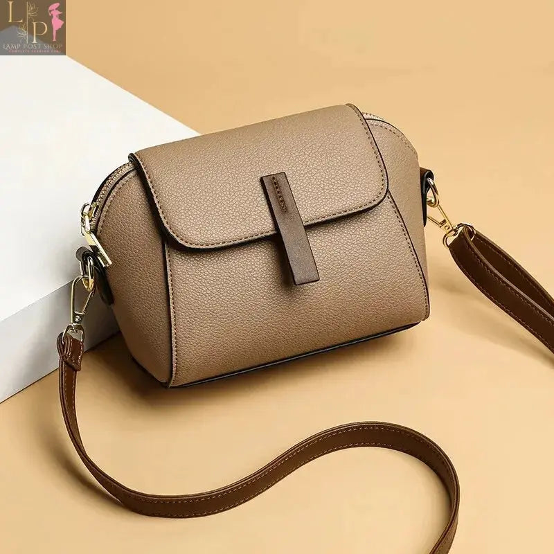 Khaki leather shoulder bag for women featuring a solid color flap and crossbody strap, stylish and versatile accessory.