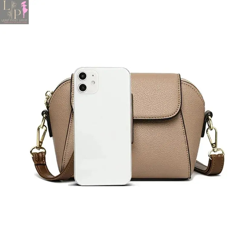 Khaki leather shoulder bag for women with solid color flap and crossbody strap, stylish and versatile accessory.