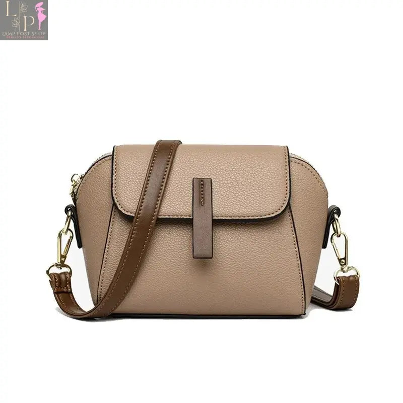 Khaki leather shoulder bag for women with solid color flap and crossbody strap, stylish and functional accessory.