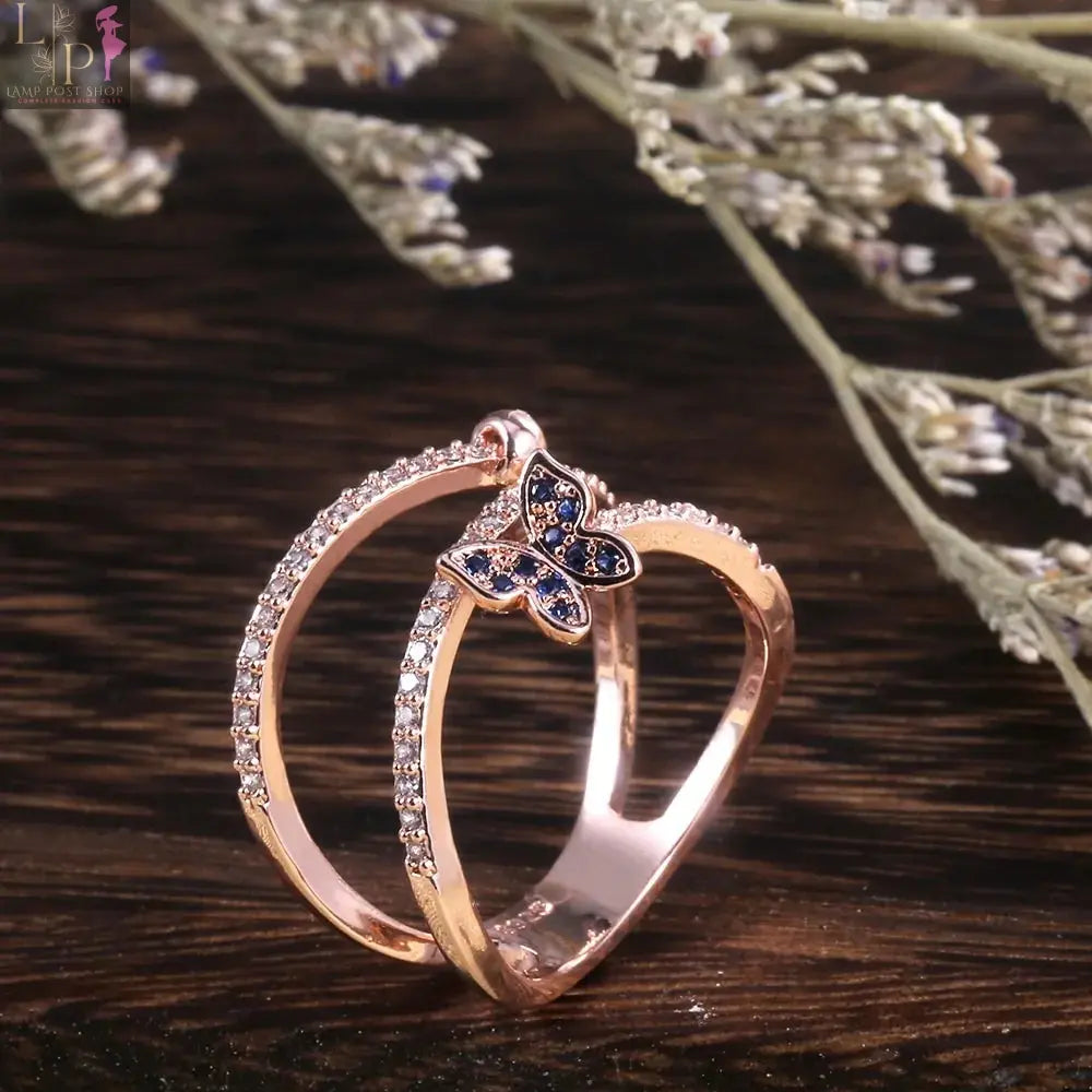 Rose gold butterfly-shaped ring from My Store, featuring delicate butterfly designs on a sleek band.