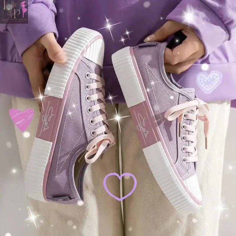 White women's low-top canvas sneakers with lace-up design, flat casual shoes, breathable and vulcanized sole, soft and comfortable fit.