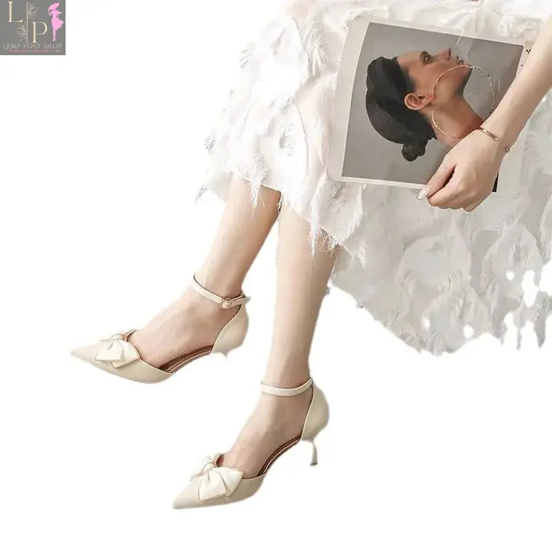 White women's elegant heels with a sleek design, perfect for weddings, formal events, and bridal parties.