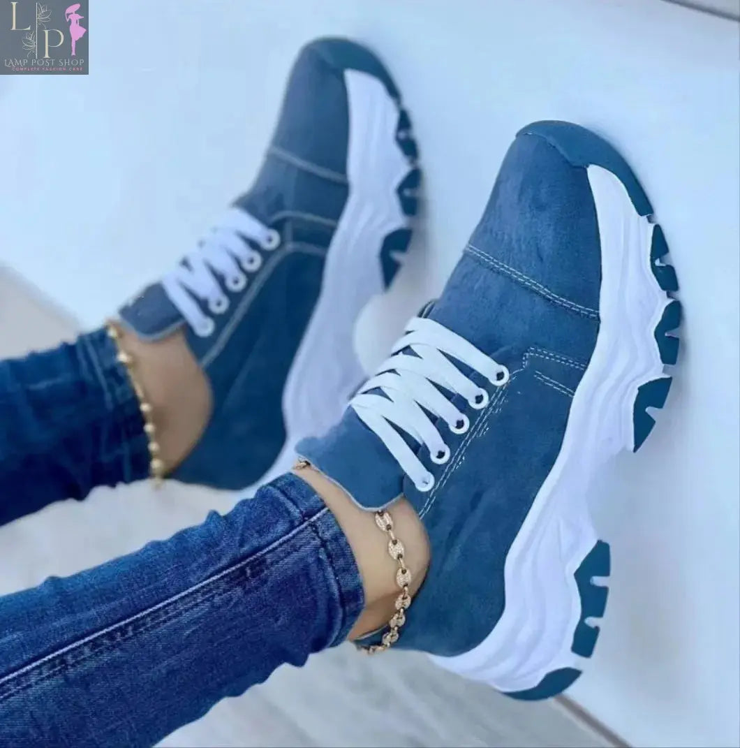 Pink women's canvas sneakers with flat laces, casual sport shoes, stylish and comfortable for everyday wear.