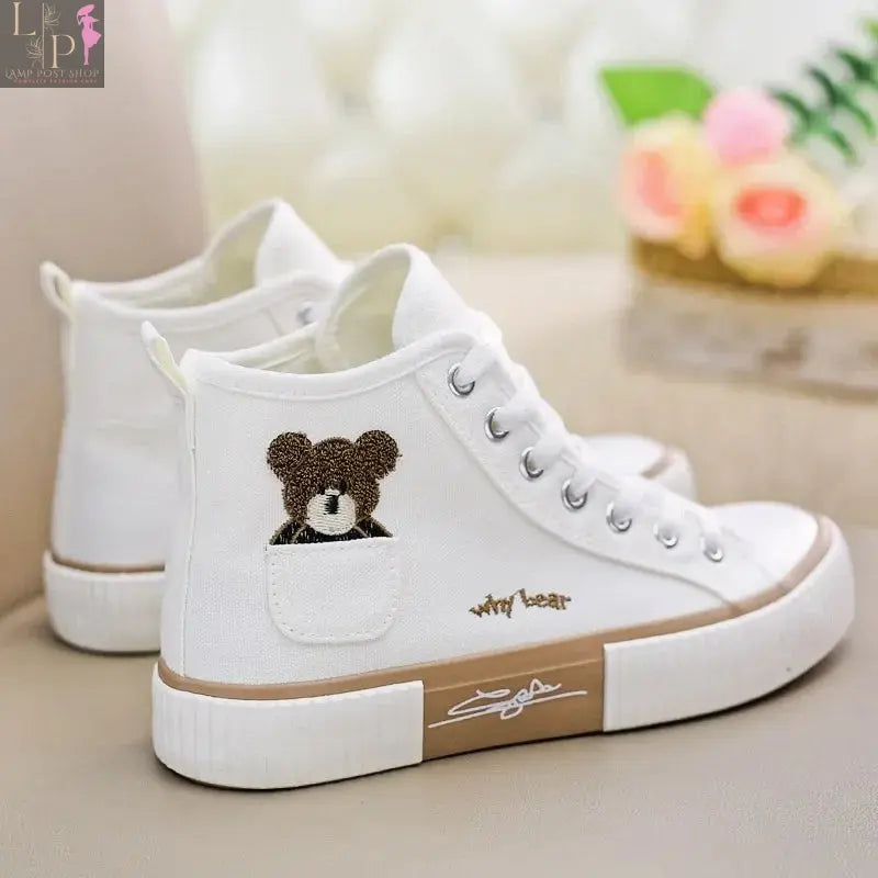 White women’s sneakers by My Store, casual vulcanized high-top shoes with flat sole and sporty design.