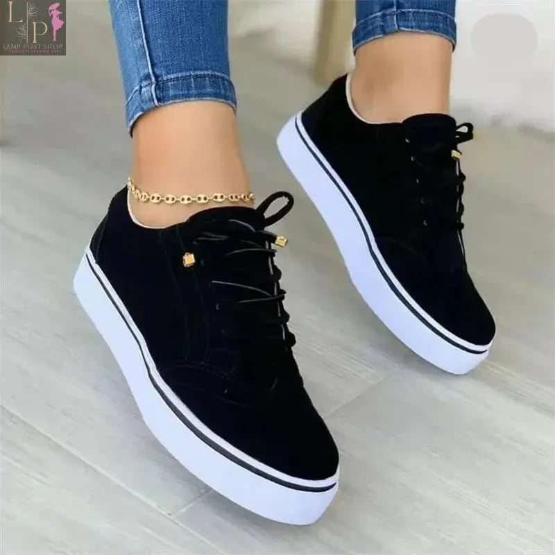White women's round toe casual flat shoes with lace-up design, versatile and comfortable for walking and everyday wear.