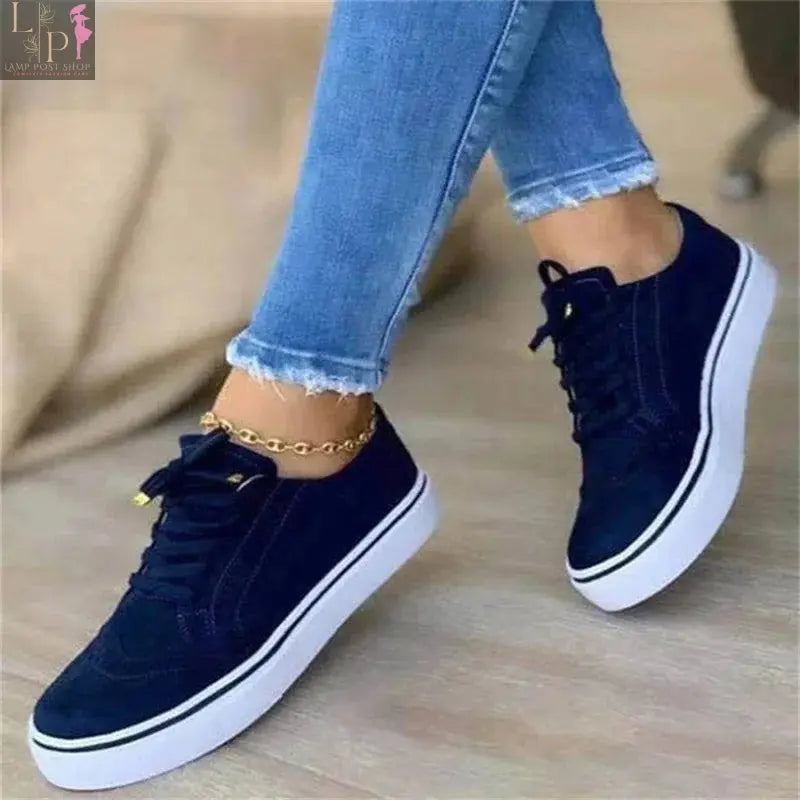 White women's round toe casual flat shoes with lace-up design, versatile and comfortable for walking and everyday wear.