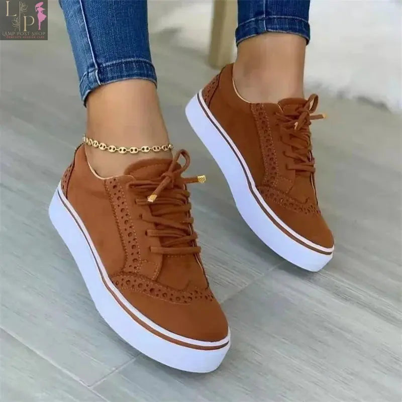 White women's flat lace-up shoes with round toe, casual style, versatile design, comfortable for walking and everyday wear.