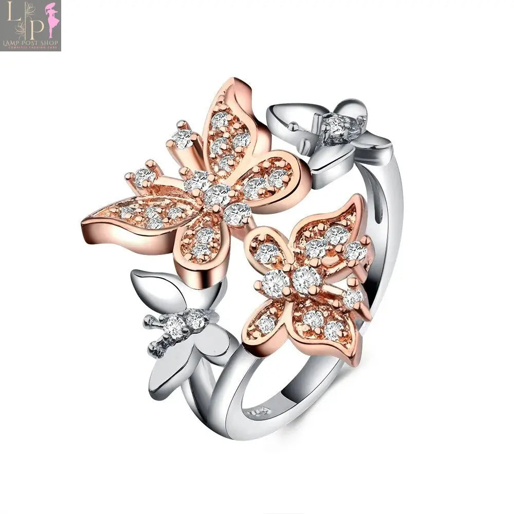 White butterfly engagement ring from My Store featuring delicate butterfly accents and a sleek band design.